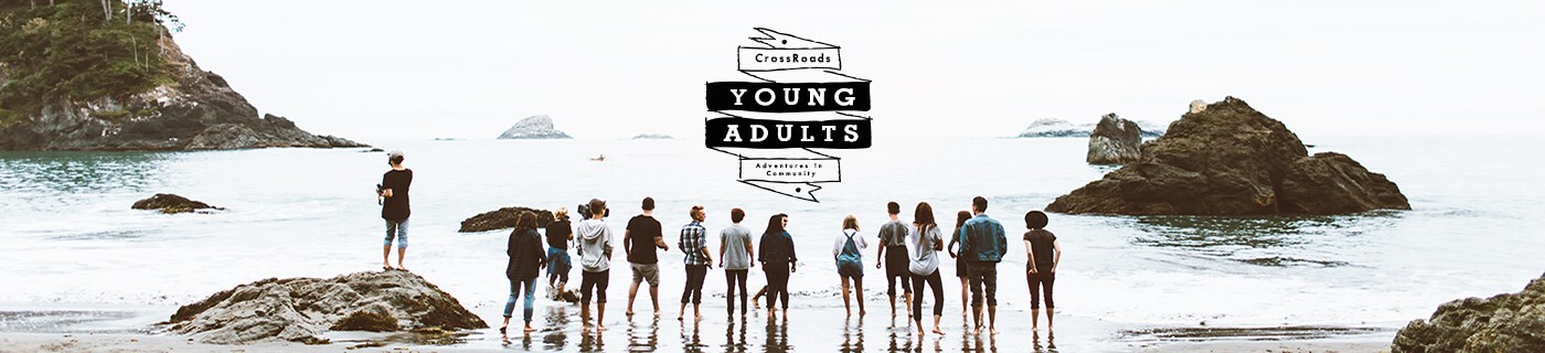 young adults in front of ocean